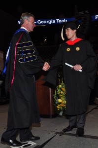 Paul Zachowski (right) shaking hands with GT President George P. "Bud" Peterson (left) at the Spring 2015 commencement ceremony.